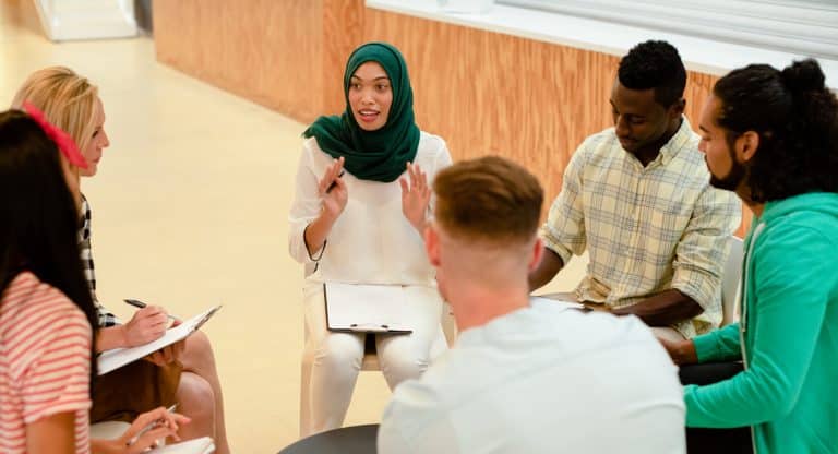 Diverse group of people seeking psychological first aid to support mental health in South Africa