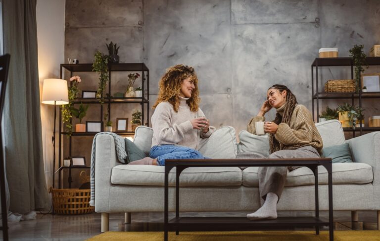 Young women having a conversation, displaying different types of body language