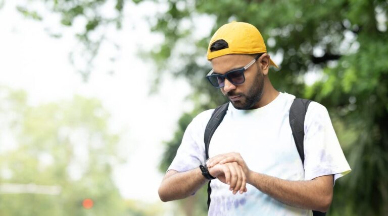 Young student using good time management to plan his day
