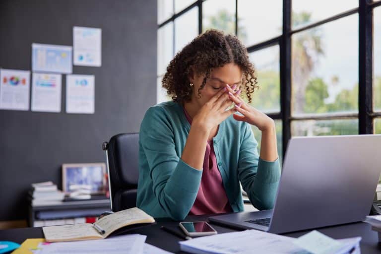 Woman with anxiety at her desk