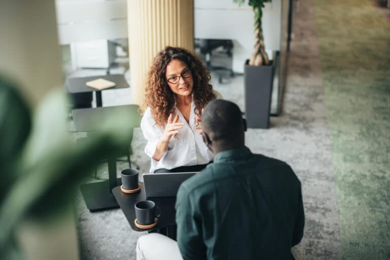Business meeting where management speak about how to develop emotional intelligence in the workplace
