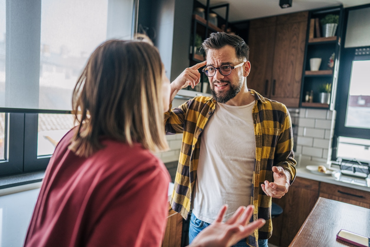 Man and women having an argument about gaslighting in the kitchen