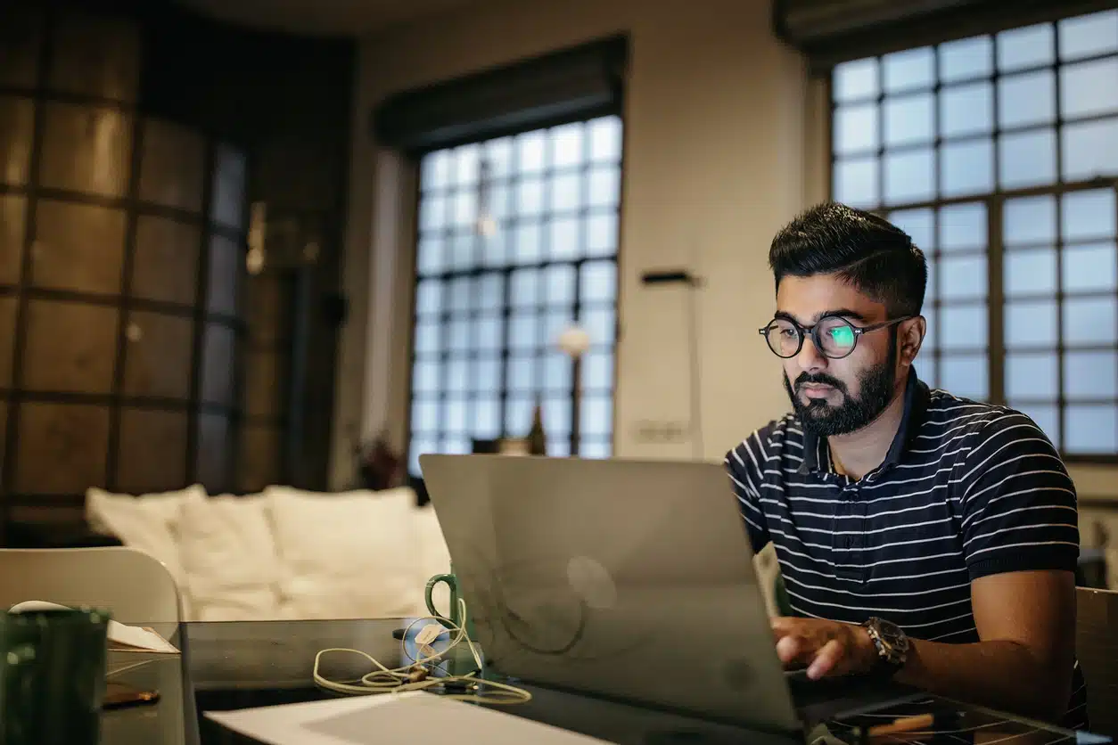 Man exhausted working from home at night