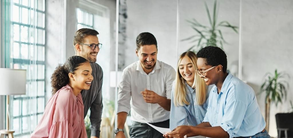 coach adding value in a corporate team meeting