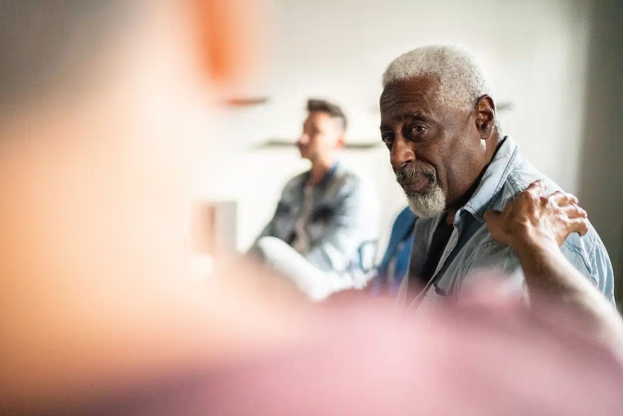 Senior man receiving support at grief and loss counselling