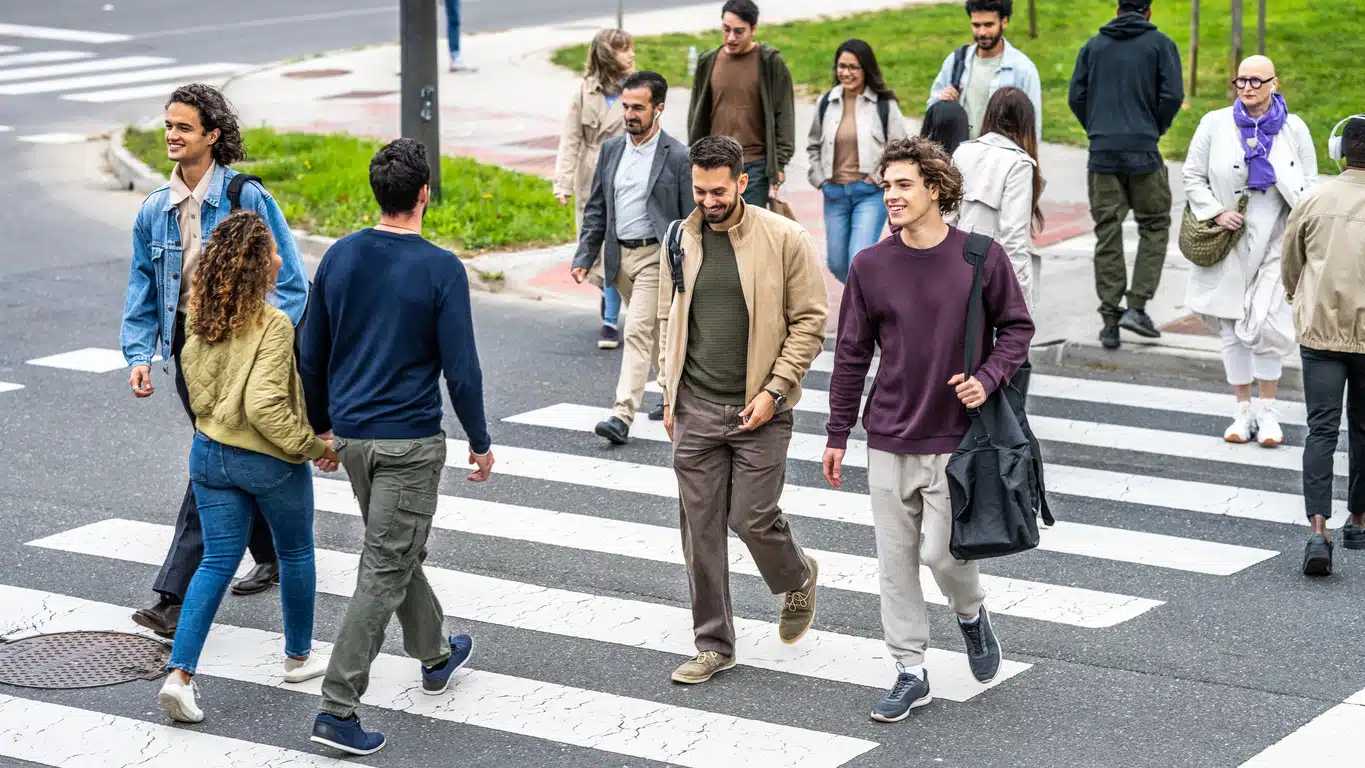 Different people crossing the road with different experiences that have shaped their human behaviour