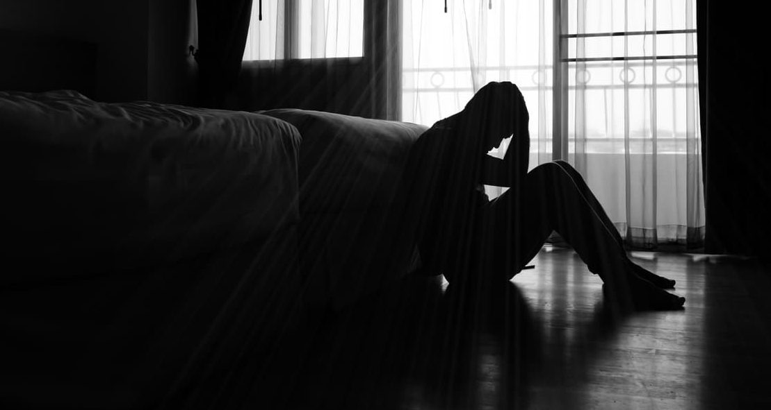 Silhouette of depressed teen, possible thoughts of suicide