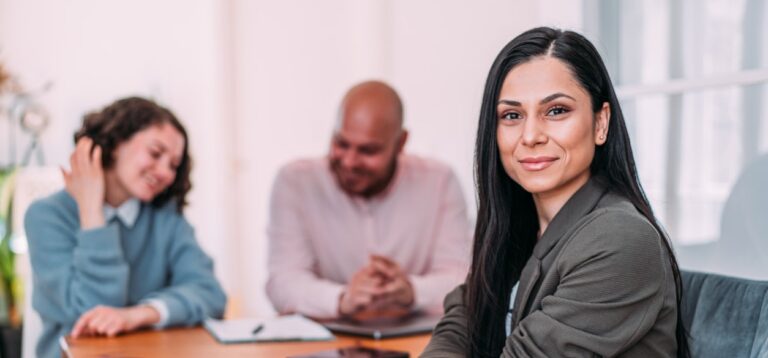 Educational Psychologist sitting with a dad and daughter