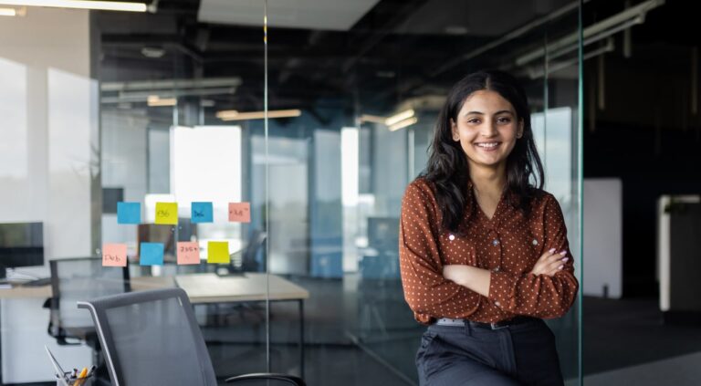 Young leader in the workspace who is happy because she leads her team with emotional intelligence