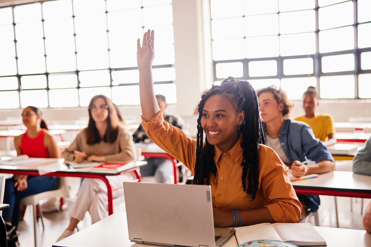 Smiling student in class prepared to have the best matric year by implementin good study tips