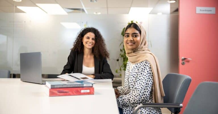 Young HR Managers in the boardroom discussing key skills they need to be successful in 2026