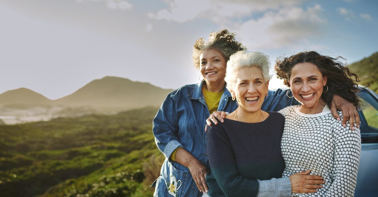 A group of woman smiling and enjoying happiness on a road trip