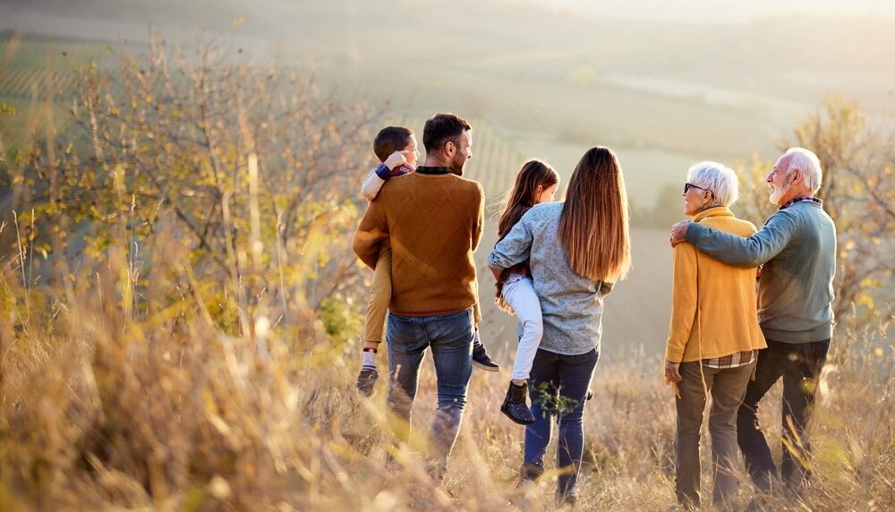 A family with multiple generations at a photoshoot.