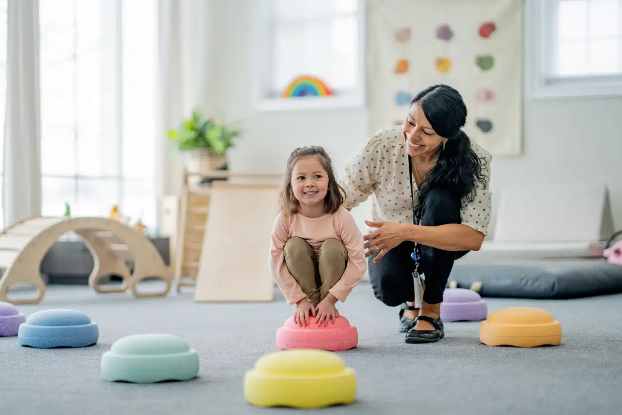 A female working with a child through play therapy