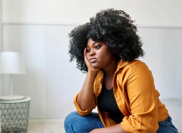 Young woman deep in thought on suicide myths and truths