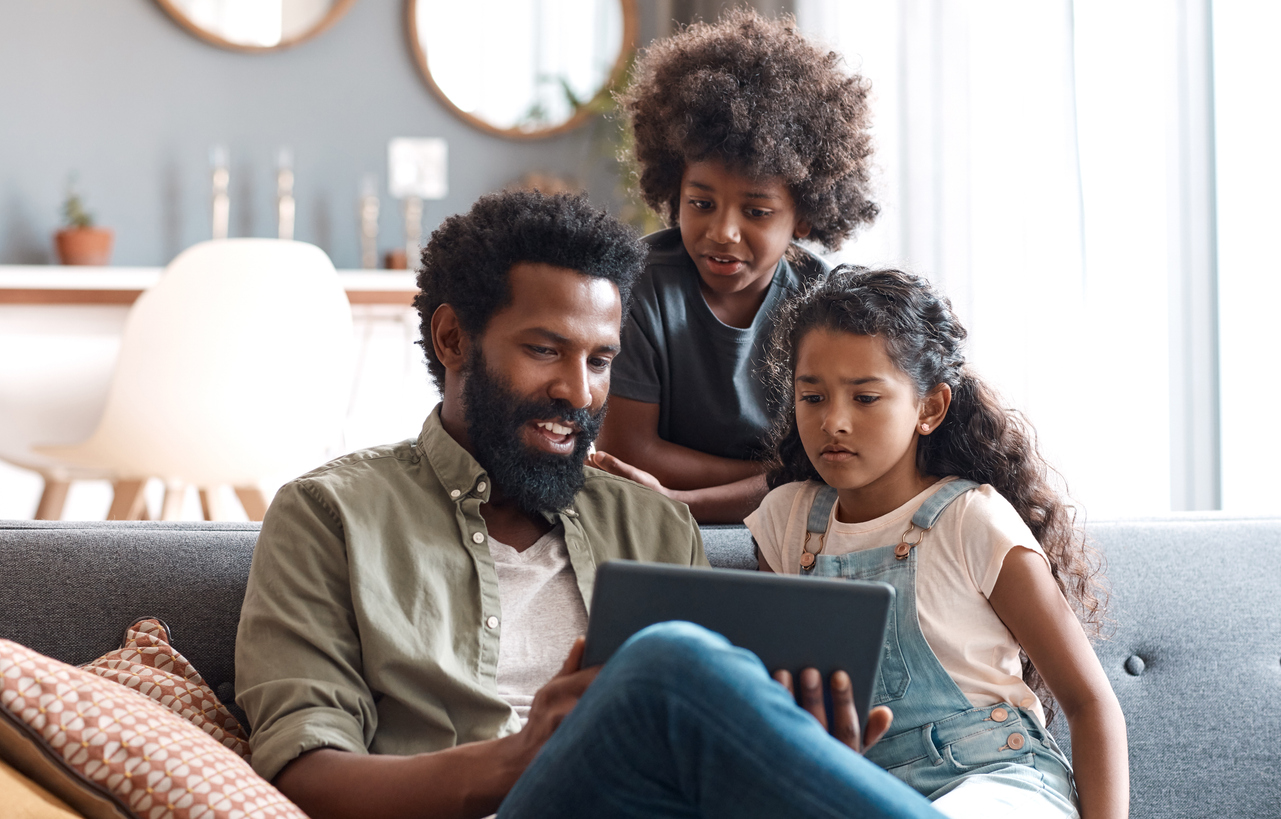 Parent teaching his children digital safety to enhance and safeguard their childhood