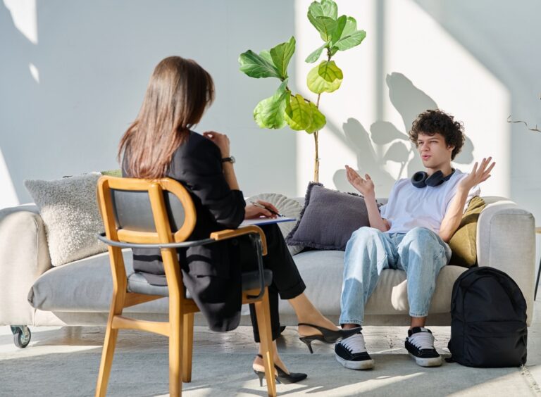 Young man asking his counsellor "What is the difference between bipolar disorder and borderling personality disorder?"