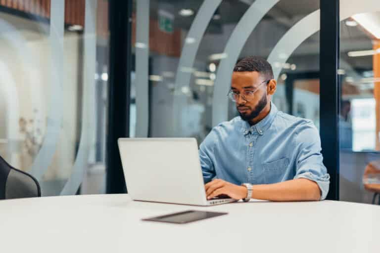 Businessman working on his laptop with a Bipolar Disorder diagnosis