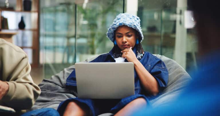 Young woman doing research and looking at the differences between qualifications for her future